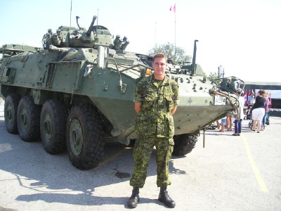 <br>      Cpl John Hewitt, an Afghanistan veteran, in front of a LAV III armoured personnel carrier.<br>    Photo: Adu Raudkivi<br>    <br>    <br>    <br>       - pics/2006/14045_21.jpg