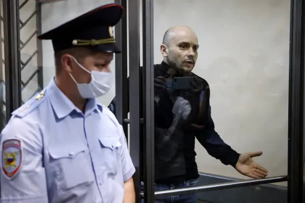 Andrei Pivovarov, head of the Open Russia movement, gestures as he stands behind glass during a court session in Krasnodar, Russia, on June 2. (AP) - pics/2021/06/58396_001_t.webp