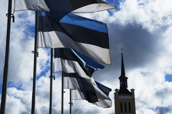 Estonian national flags flutter in the wind at Freedom Square with the St. John's Church in the background, in Tallinn, Estonia. | Pavel Golovkin/AP Photo - pics/2022/12/59802_001_t.jpg