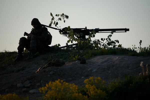 A member of the Estonian Defense Forces sits next to a large-caliber machine gun during the Spring Storm military exercises by Estonian and allied NATO forces near Kadrina, Estonia, on May 19. JAAP ARRIENS/AFP VIA GETTY IMAGES - pics/2023/05/60245_001_t.webp