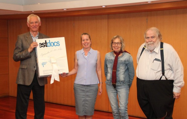 Maimu Mölder (second left), the founding director of EstDocs and director of the most recent EstDocs in 2019, hands over EstDocs digital archives and festival posters to Jaan Meri (left), President of the Estonian Museum Canada, for safekeeping. Estdocs 2019 organizing committee members Kaili Paakspuu and Rein Ende at the right. Photo: Tauno Mölder - pics/2023/06/60320_001_t.jpg